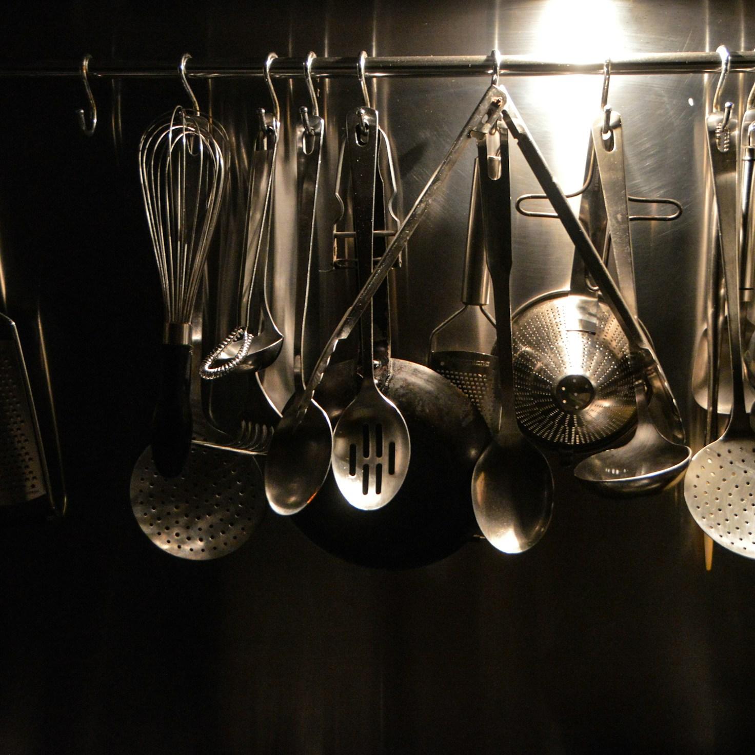 Participants collaborating in a modern kitchen, sharing recipes and techniques